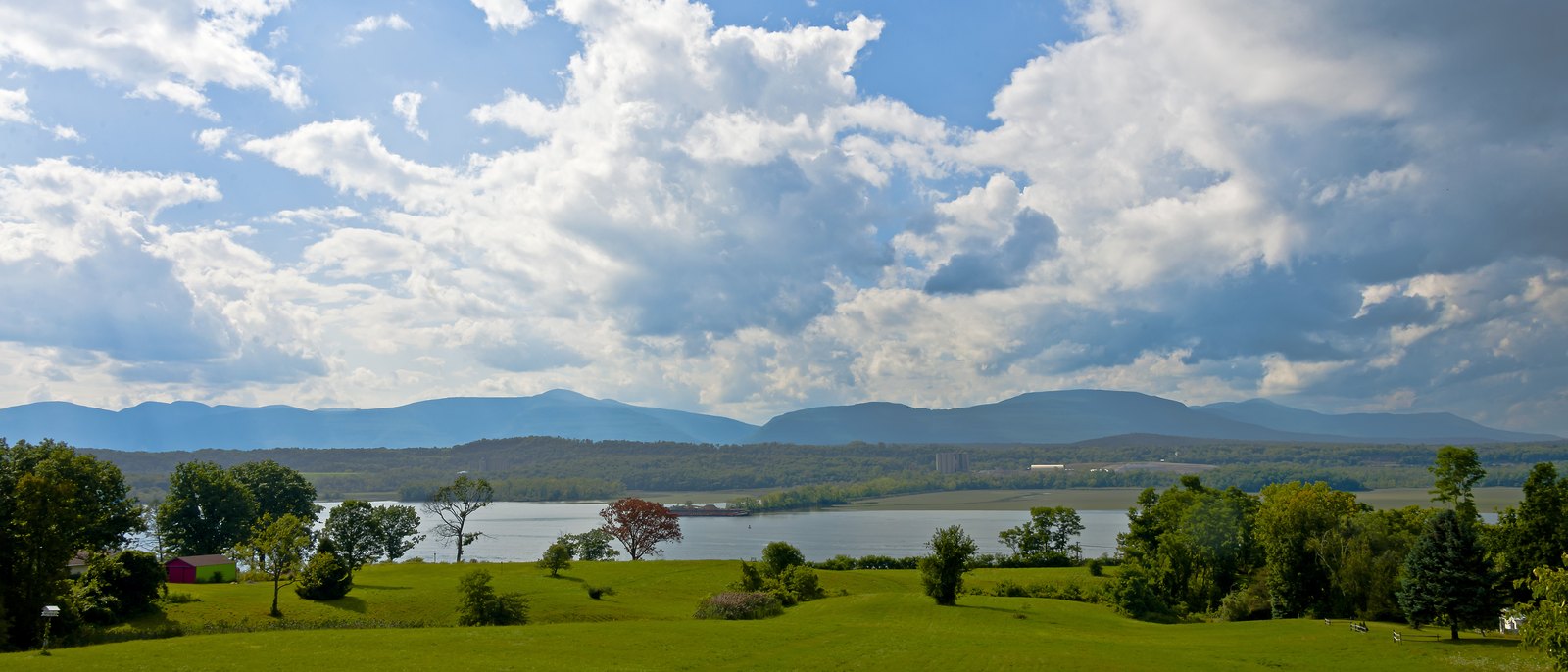 The Hudson River and the Catskill mountains under a summer sky